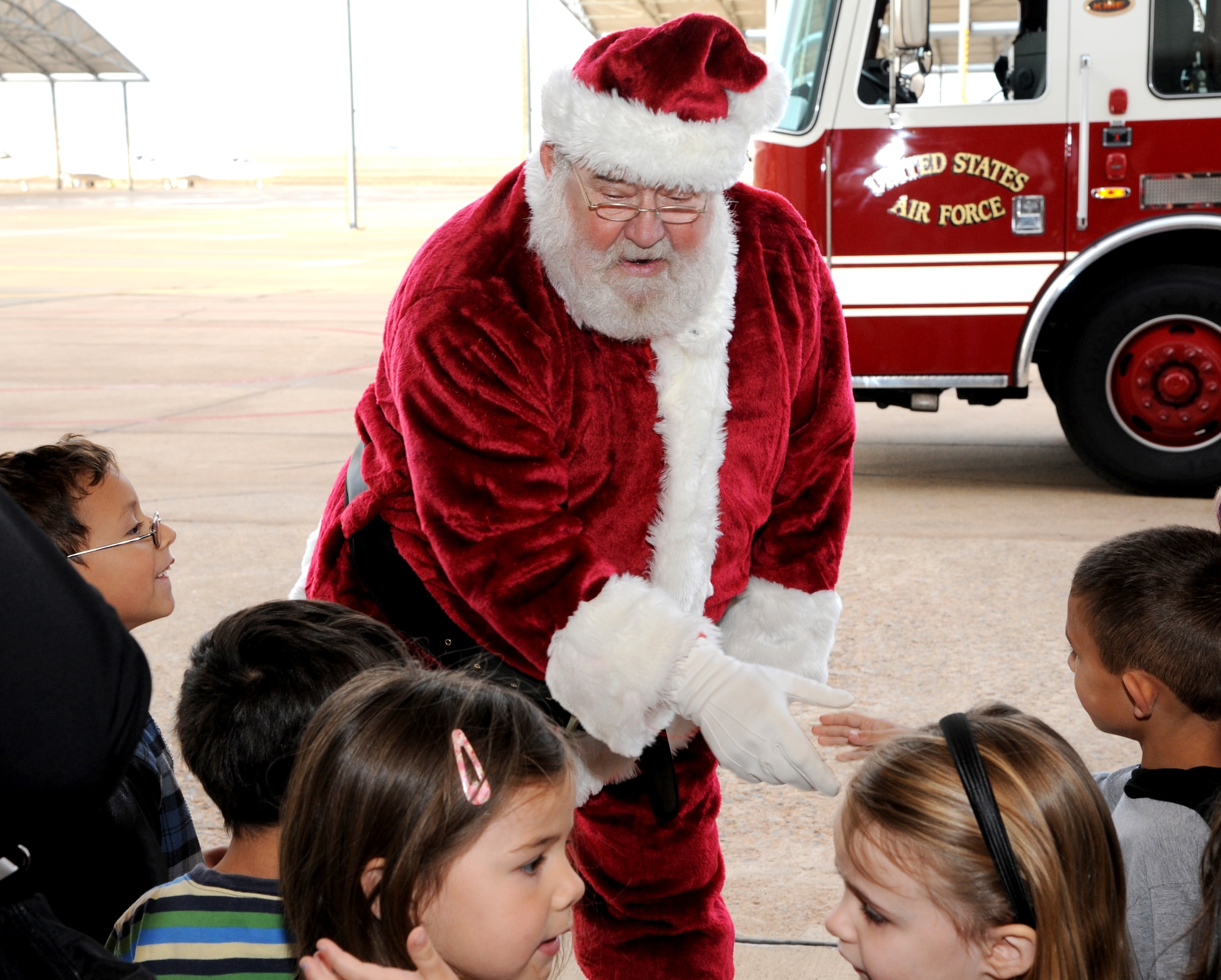 The Vance Fire Department delivered Santa Claus to Hangar 170 where he greeted his fans at Breakfast with Santa, Dec. 1, at Vance Air Force Base, Okla. More than 500 people attended the breakfast. (U.S. Air Force photo/ Airman 1st Class Frank Casciotta)