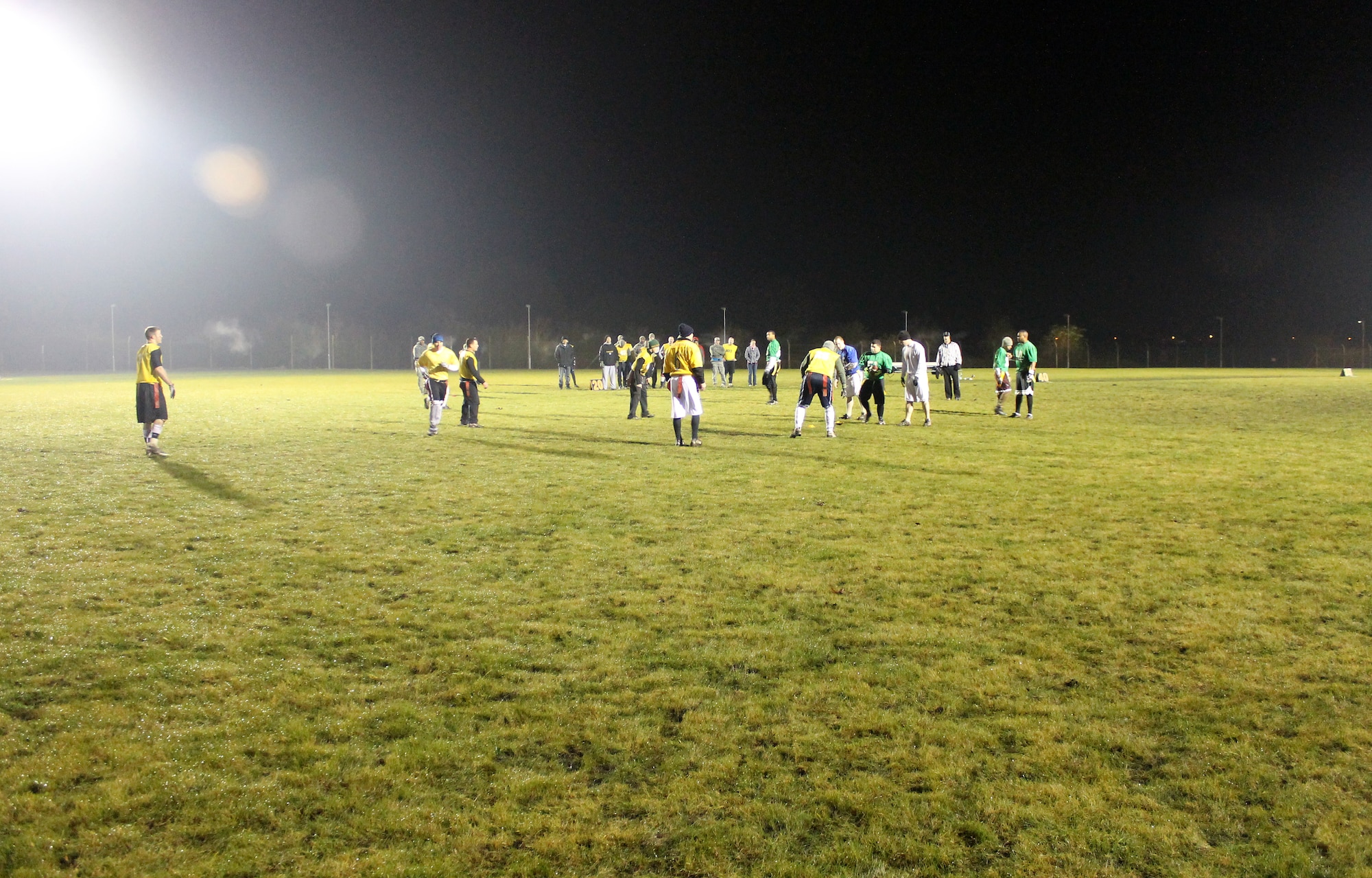 The 100th Communications Squadron/Force Support Squadron team prepares to run an offensive play during the RAF Mildenhall flag football championship game Dec. 12, 2012, at RAF Mildenhall, England. The 100th Maintenance Group team defeated Communications/Force Support by a final score of 14-12. (U.S. Air Force photo by Capt. Jason Smith/Released)