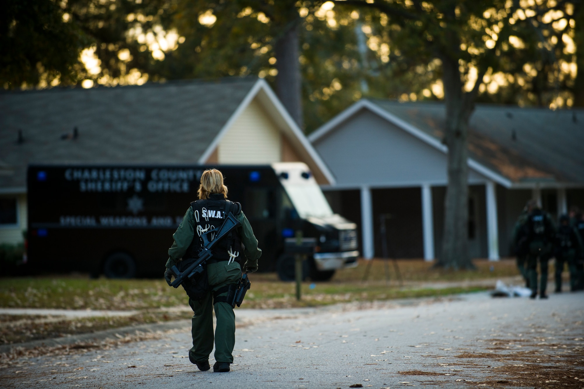 A member of the Charleston County Sheriff’s Office Special Weapons and Tactics team walks back to the equipment truck after a hostage extraction  training scenario Dec. 6, 2012, at Joint Base Charleston - Air Base, S.C.. The SWAT team provides a coordinated response to critical incidents throughout Charleston County, and whenever requested, in other areas throughout the state of South Carolina.  (U.S. Air Force photo/ Airman 1st Class George Goslin)
