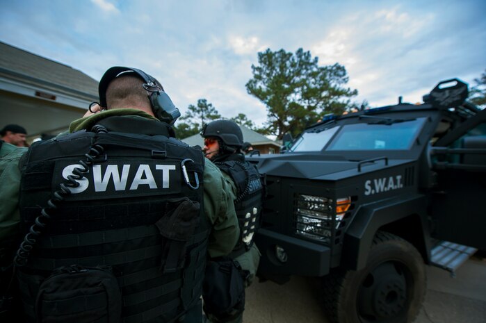 A member of the Charleston County Sheriff’s Office Special Weapons and Tactics team checks his communication equipment Dec. 6, 2012, at Joint Base Charleston - Air Base, S.C. during a training exercise. The SWAT team provides a coordinated response to critical incidents throughout Charleston County, and whenever requested, in other areas throughout the state of South Carolina.  (U.S. Air Force photo/ Airman 1st Class George Goslin)