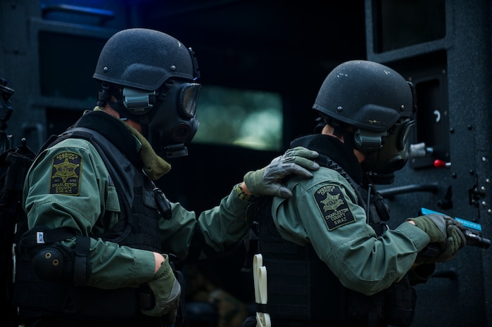 Members of the Charleston County Sheriff’s Office Special Weapons and Tactics team prepare to raid a house Dec. 6, 2012, at Joint Base Charleston - Air Base, S.C. as part of a training exercise. The SWAT team provides a coordinated response to critical incidents throughout Charleston County, and whenever requested, in other areas throughout the state of South Carolina. (U.S. Air Force photo/ Airman 1st Class George Goslin)