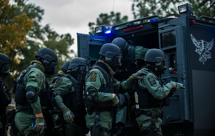 Members of the Charleston County Sheriff’s Office Special Weapons and Tactics team prepare to raid a house Dec. 6, 2012, at Joint Base Charleston - Air Base, S.C. as part of a training exercise. The SWAT team provides a coordinated response to critical incidents throughout Charleston County, and whenever requested, in other areas throughout the state of South Carolina. (U.S. Air Force photo/ Airman 1st Class George Goslin)