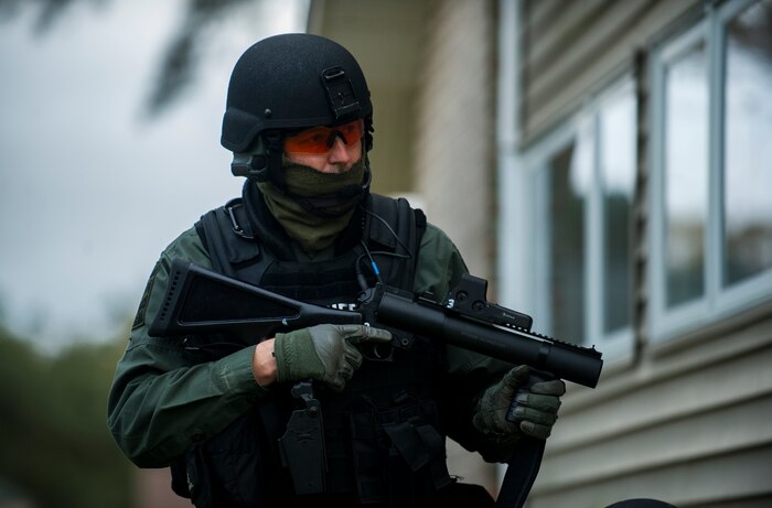 A member of the Charleston County Sheriff’s Office Special Weapons and Tactics team holds position during a hostage extraction training exercise Dec. 6, 2012, at vacant housing on Joint Base Charleston – Air Base, S.C.  The SWAT team provides a coordinated response to critical incidents throughout Charleston County, and whenever requested, in other areas throughout the state of South Carolina. (U.S. Air Force photo/ Airman 1st Class George Goslin)