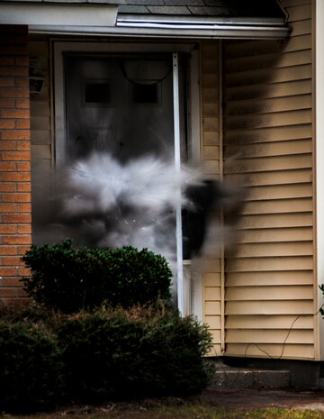 A charge set by the Charleston County Sheriff’s Office Special Weapons and Tactics team explodes during a hostage extraction training exercise Dec. 6, 2012, at vacant housing on Joint Base Charleston – Air Base, S.C. (U.S. Air Force photo/ Senior Airman Dennis Sloan)