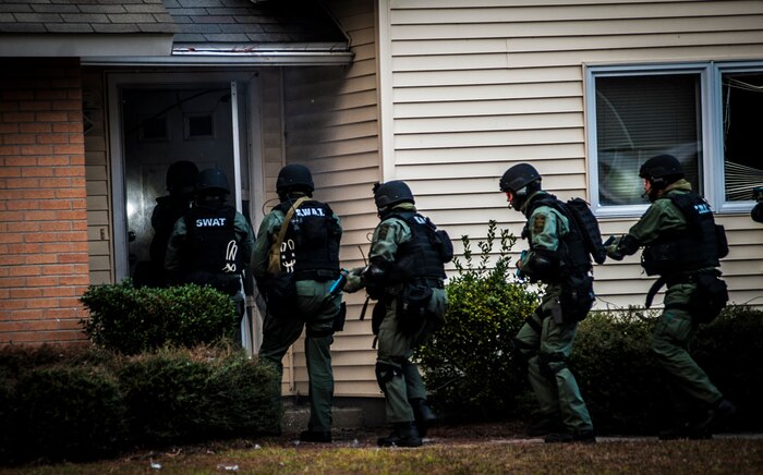 Charleston County Sheriff’s Office Special Weapons and Tactics team breach a house after using explosives on the front door during a hostage extraction training exercise Dec. 6, 2012, at vacant housing on Joint Base Charleston – Air Base, S.C. (U.S. Air Force photo/ Senior Airman Dennis Sloan)