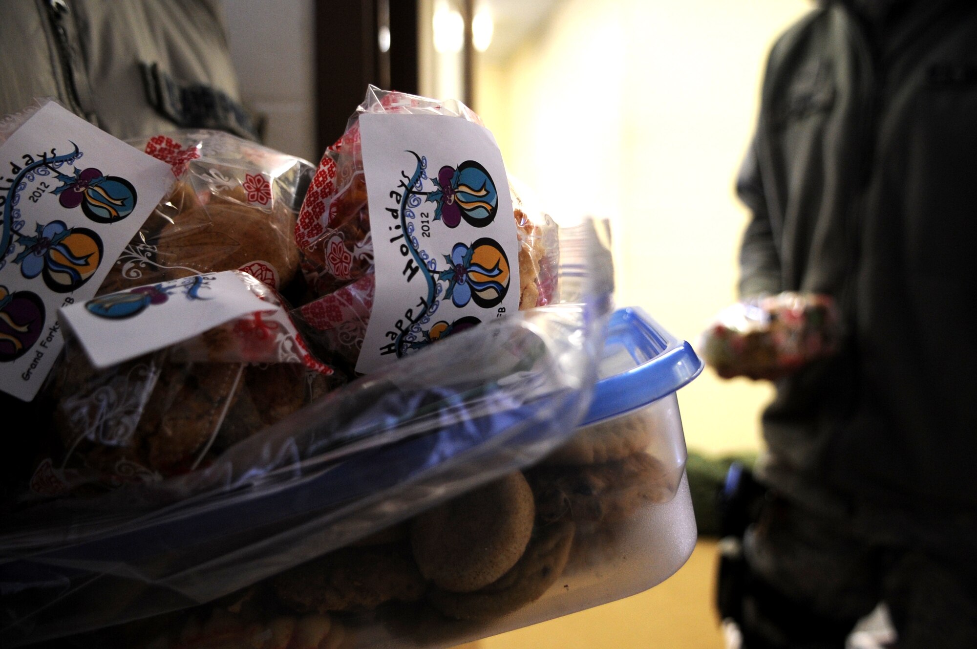 Members of the Grand Forks Air Force Base First Sergeants’ Council deliver packaged cookie bags and tins to Airmen stationed on Cavalier Air Station, N.D., Dec. 10, 2012. Every year, the Grand Forks Air Force Base Spouses’ Club shows their appreciation to Airmen on base by baking cookies and assembling cookie bags to surprise Airmen who live in the dorms. This year, the First Sergeants’ Council delivered cookies to Airmen stationed on Cavalier Air Station and Grand Forks AFB, N.D. (U.S. Air Force photo/Staff Sgt. Amanda N. Grabiec)