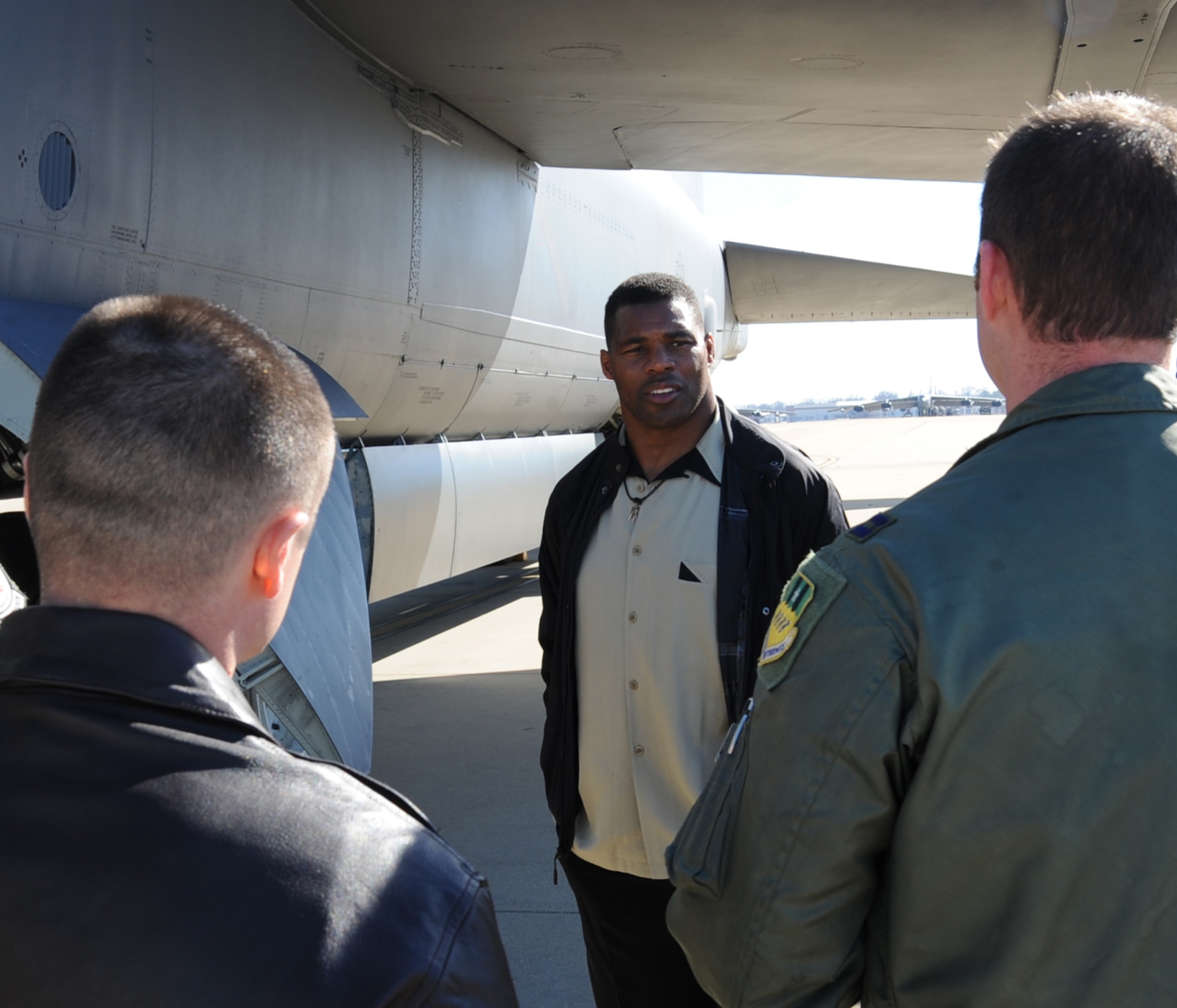 Herschel Walker, former two-time Olympian, speaks with members from the 20th Bomb Squadron during a static display on Barksdale Air Force Base, La., Dec. 11. Walker was here on behalf of The Freedom Care Program Anti-Stigma Campaign. (U.S. Air Force photo/Senior Airman Sean Martin)