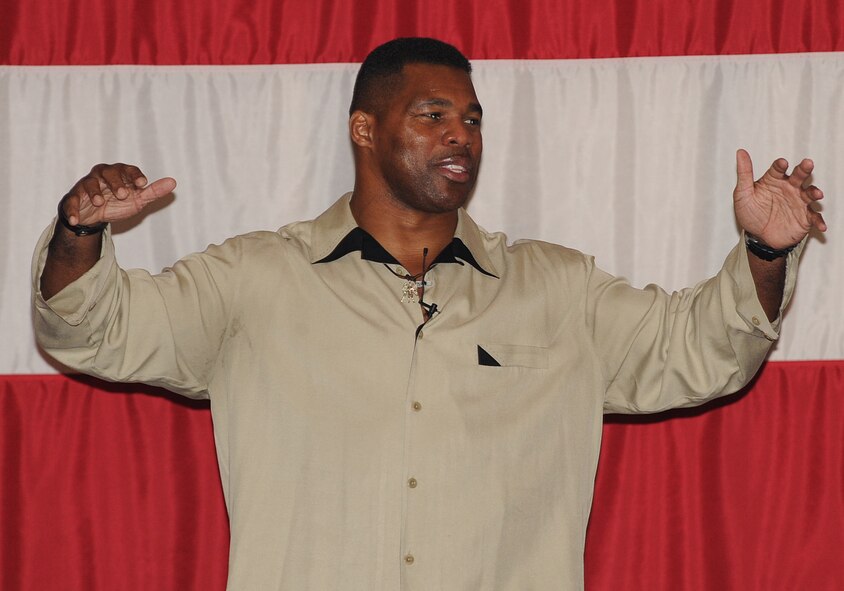 Herschel Walker, Heisman Trophy winner, speaks to Airmen during his visit to Barksdale Air Force Base, La., Dec. 11. Walker was here on behalf of The Freedom Care Program Anti-Stigma Campaign. (U.S. Air Force photo/Senior Airman Sean Martin)