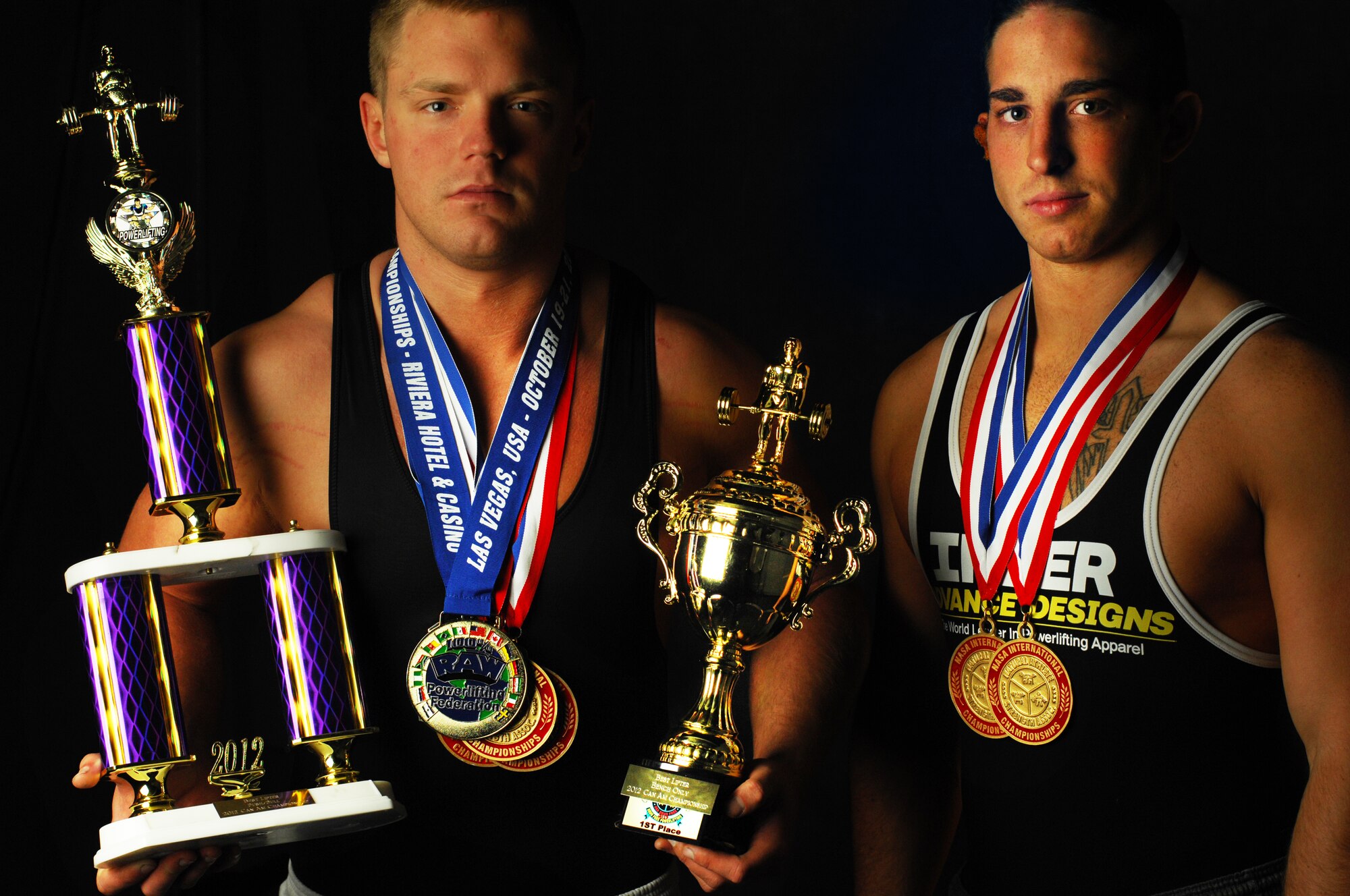 MINOT AIR FORCE, N.D. – (L-R) Airman 1st Class Austin Pappas and Senior Airman Robert Lesser, both crew chiefs assigned to the 5th Aircraft Maintenance Squadron, proved their worth at a local powerlifting competition Dec. 1 at the YMCA in Minot, N.D. For Lesser, it was an afternoon of record breaking scores, while for Pappas, it was complete domination over competitors. (U.S. Air Force photo/Senior Airman Brittany Y. Auld)
