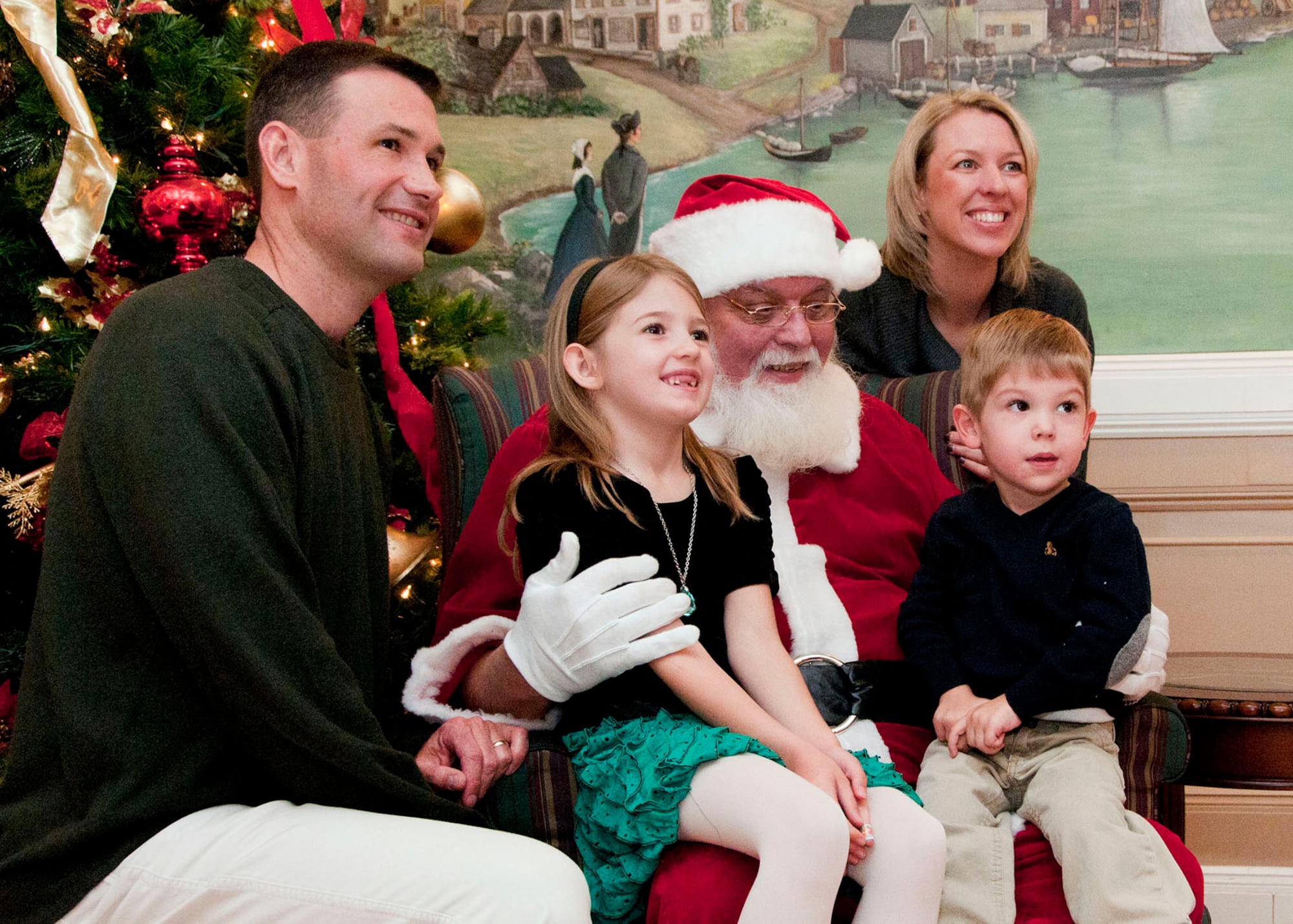 HANSCOM AIR FORCE BASE, Mass. -- The Gish family poses for a photo with Santa Claus at the Hanscom Spouses Club annual Breakfast with Santa event at the Minuteman Commons Dec. 8. The morning included children's activities, an elf workshop, performances by Magic Dave and Mr. Balloon as well as a special appearance by Santa and Mrs. Claus. (U.S. Air Force photo by Mark Wyatt)