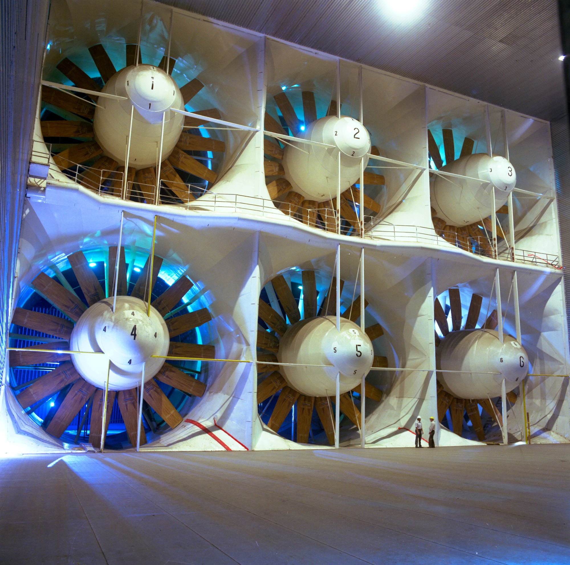 AEDC National Full-Scale Aerodynamic Complex’s (NFAC) 80 by 120-foot Wind Tunnel’s drive fans dwarf workers taking part in the initial system checkouts conducted in 1986 prior to the complex’s reactivation after the Air Force assumed management of the two largest wind tunnels at NASA Ames Research Center near Moffett Field, in Mountain View, Calif. in 2006. (File photo)