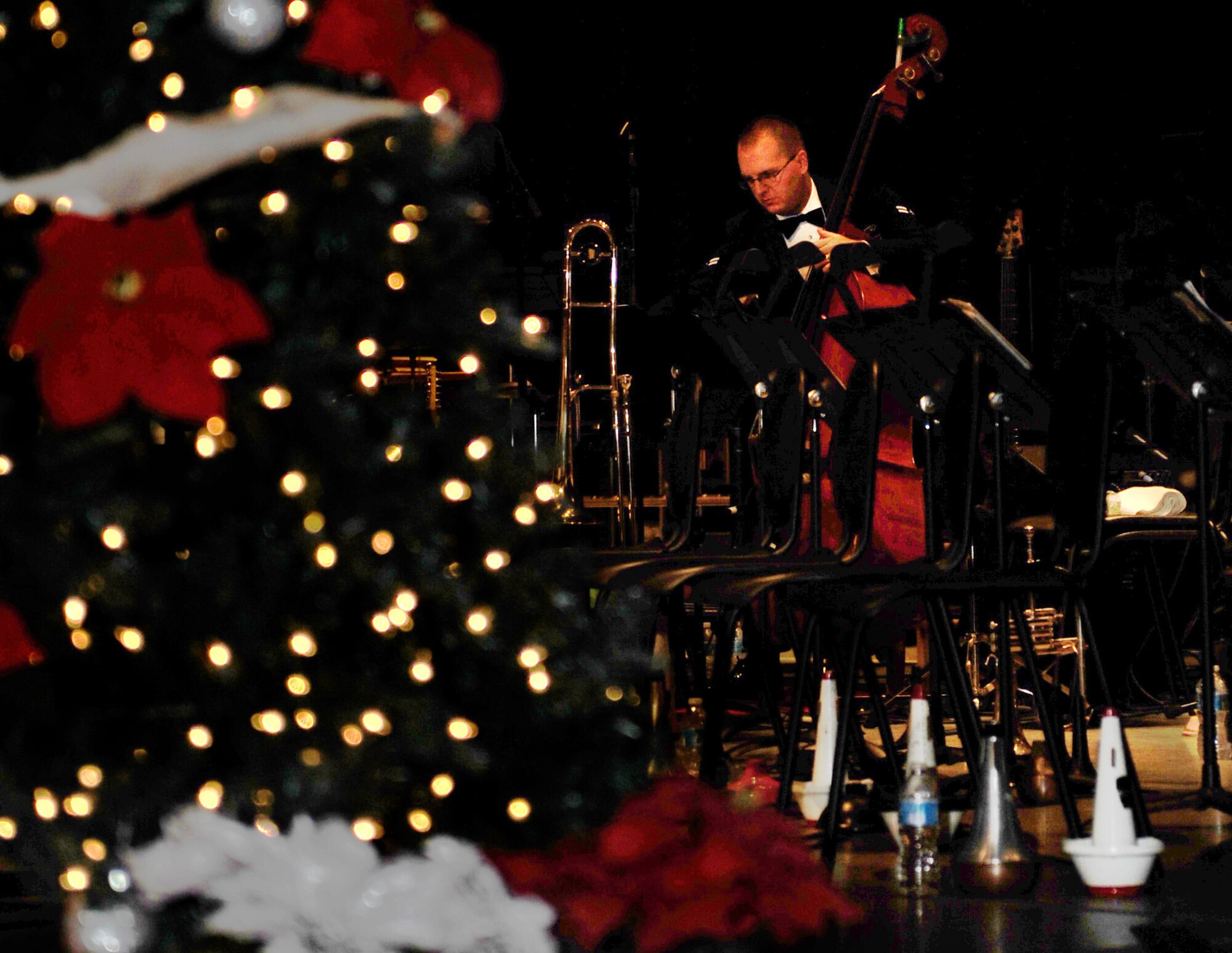 Airman 1st Class Chris Haughey, a bassist for the Air Force's Band of Mid-America at Scott, prepares for the holiday concert, "Together for the Holidays Dec. 9 at St. Louis Scottish Rite.  Haughey grew up in St. Louis and has been at Scott since Aug. 2011.  (U.S. Air Force photo/Staff Sgt. Maria Bowman)