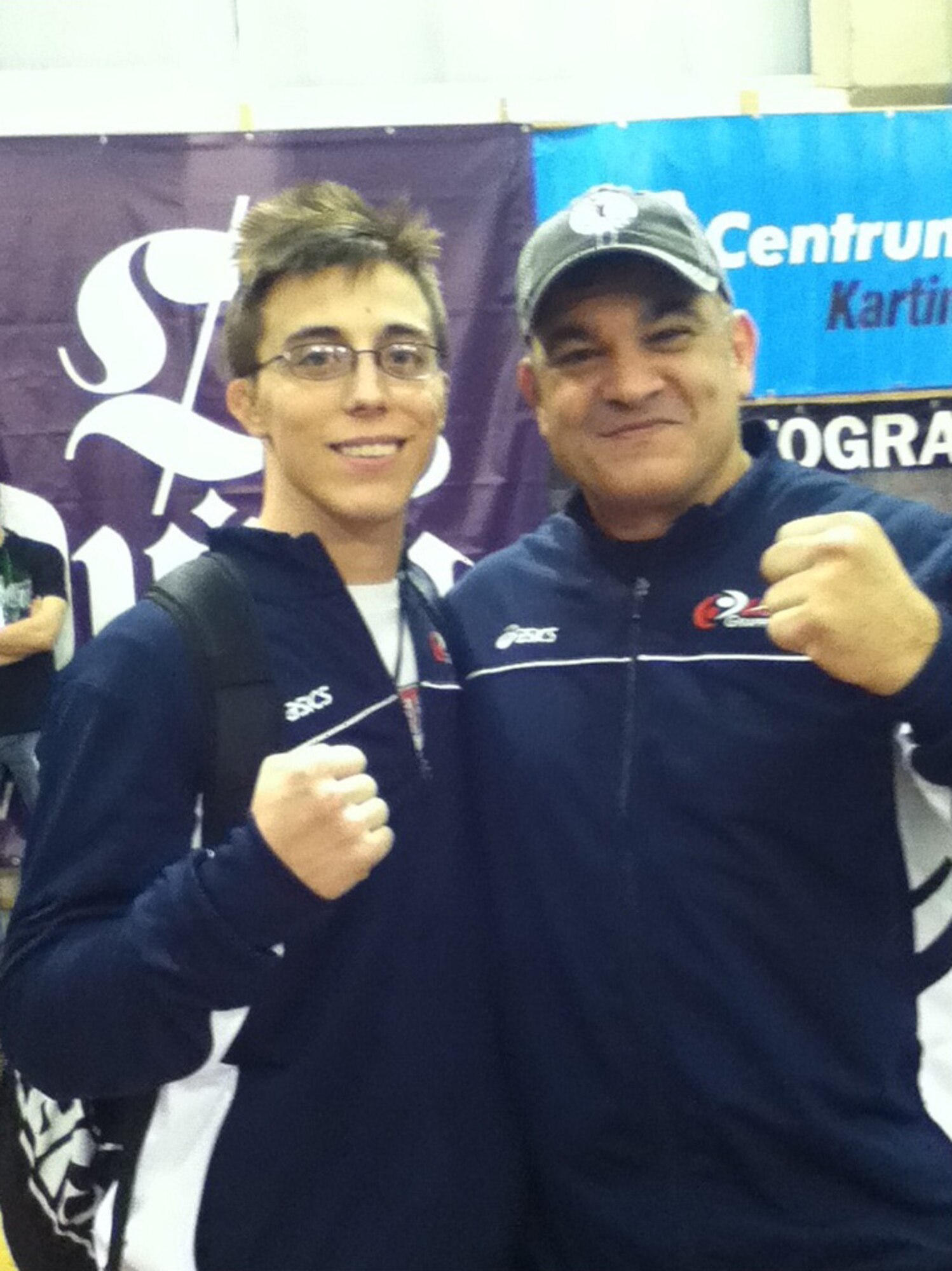 U.S. Air Force Staff Sgt. Ryan Vottero, 355th Security Forces Squadron (Left) poses for a picture with his coach, Ricardo Liborio, during a wrestling tournament in Poland. (Courtesy photo)