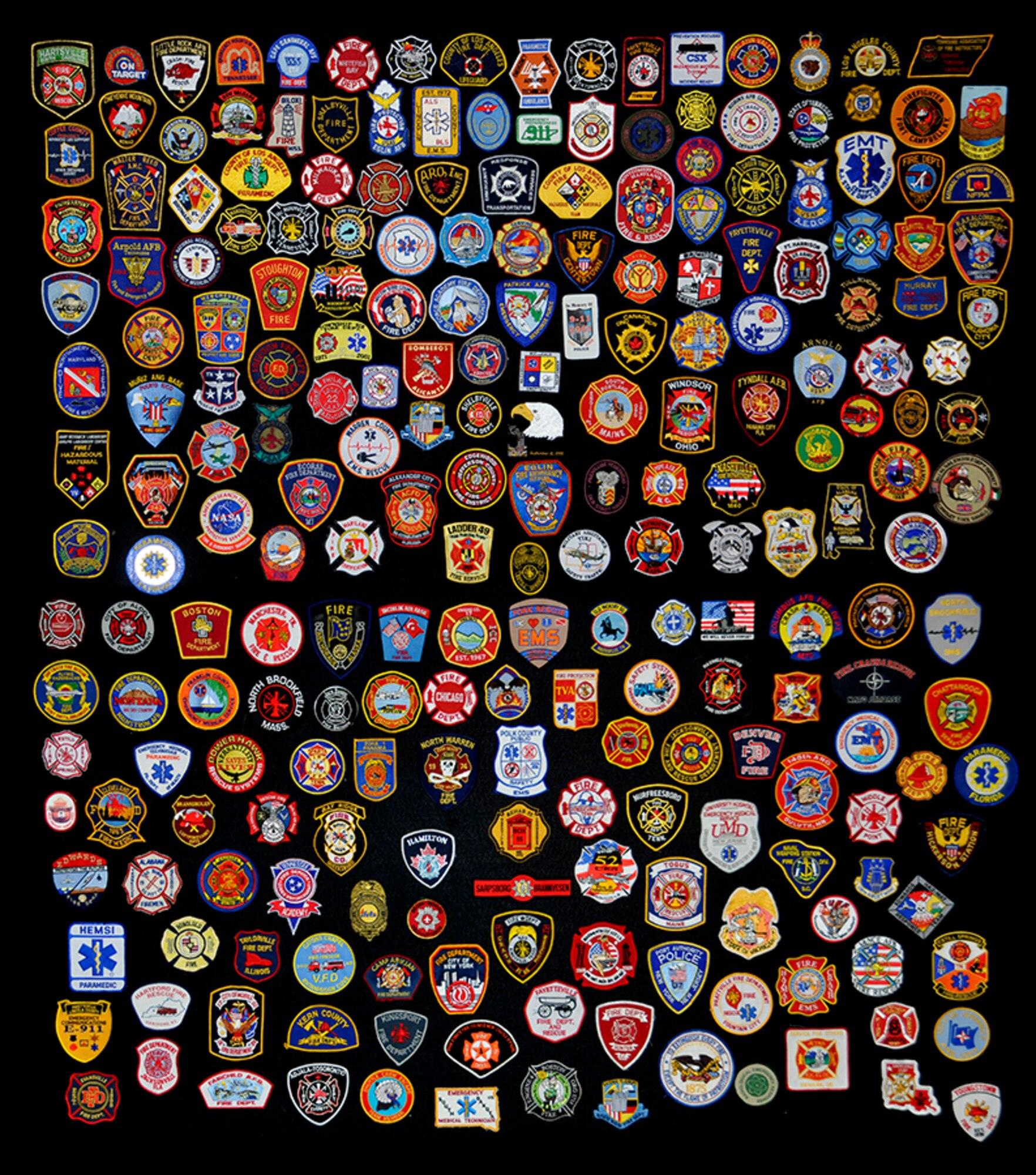 Arnold Engineering Development Center fire department personnel put their crew patches together on a black background for a high resolution photograph used to make a poster to provide moral support to Mark Kelly Olson, a 10-year-old boy battling cancer at Vanderbilt Medical Center in Nashville, Tenn. (Photo by Rick Goodfriend)