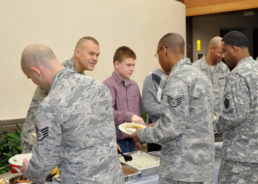 Chief Master Sergeant of the Air Force James A. Roy serves lunch at the Charles C. Carson Center for Mortuary Affairs, Dover Air Force Base, Del., Dec. 12, 2012. Roy came to visit the men and women and thank them for their support of this sacred mission. He will retire next month after more than 30 years of service. (U.S. Air Force photo/Master Sgt. Cherie McNeill)