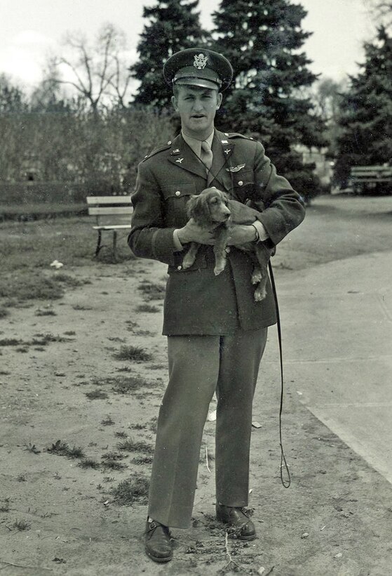 1st Lt. Edward Peterson and his Cocker Spaniel, Honey. Honey often accompanied Peterson during his flights. (U.S. Air Force photo)