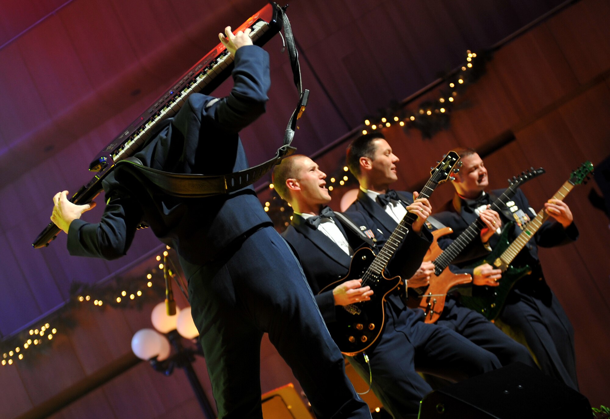 Senior Airman Ryan Rager shows his amazing skills on keyboards during the guitar hero act of the night. The U.S. Air Force Heartland of America Band From Offutt Air Force Base performed various holiday favorites at the Holland Performing Arts Center in Omaha, Neb., Dec. 7. (U.S. Air Force photo by Jeff W. Gates/Released)