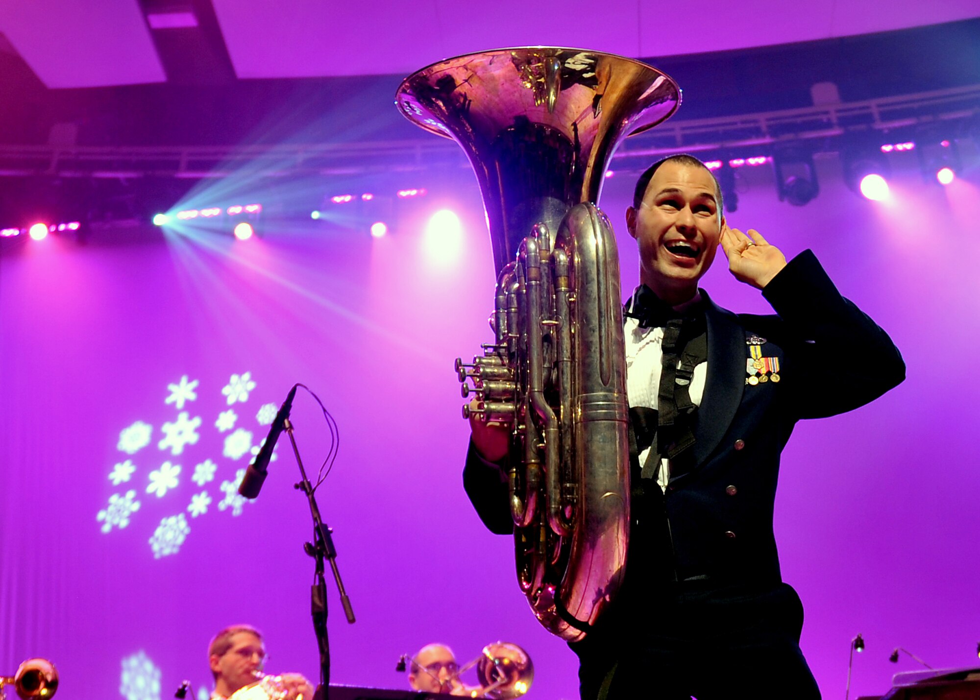 Staff Sgt. George Father on the trombone with the U.S. Air Force Heartland of America Band, asks for crowd participation. . The 2012 concert theme was “A Hometown Holiday” welcoming patrons from all over the Omaha area to a free concert at the Holland Performing Arts Center in Omaha, Neb., Dec. 7. (U.S. Air Force photo by Jeff W. Gates/Released)