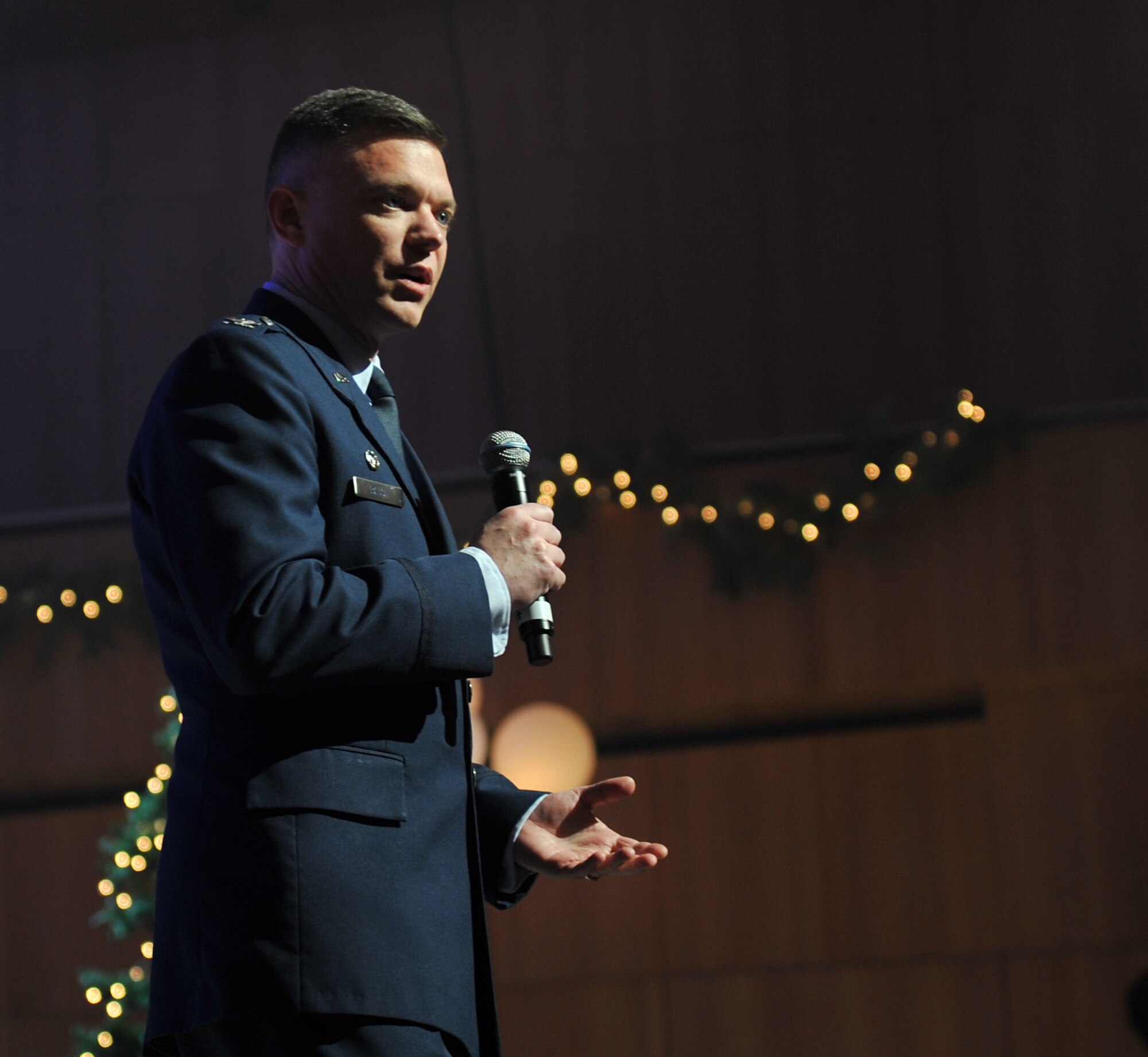 Col. John Rauch, 55th Wing commander, welcomes patrons to the concert and thanks the Omaha World Herald for their support. The U.S. Air Force Heartland of America Band performed various holiday favorites at the Holland Performing Arts Center in Omaha, Neb., Dec. 7. The band works in conjunction with the Omaha World Herald to put the concert series together each year. (U.S. Air Force photo by Jeff W. Gates/Released)