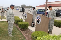 Airmen from the 902nd Security Forces Squadron attend the command dedication of their Operation Iraqi Freedom and Operation Enduring Freedom Defenders Wall Dec. 6. The memorial wall is in the 902nd SFS building at Joint Base San Antonio-Randolph honoring nine fallen Airman. (U.S. Air Force photo by Joshua Rodriguez)