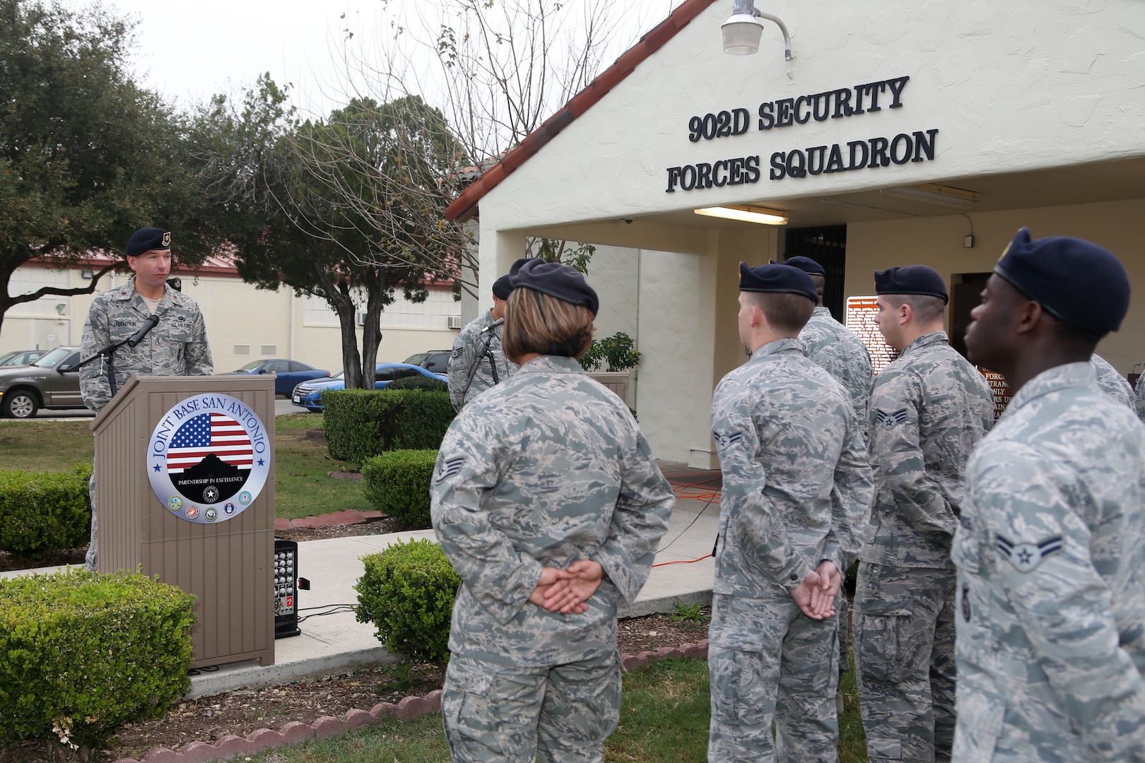 Airmen from the 902nd Security Forces Squadron attend the command dedication of their Operation Iraqi Freedom and Operation Enduring Freedom Defenders Wall Dec. 6. The memorial wall is in the 902nd SFS building at Joint Base San Antonio-Randolph honoring nine fallen Airman. (U.S. Air Force photo by Joshua Rodriguez)