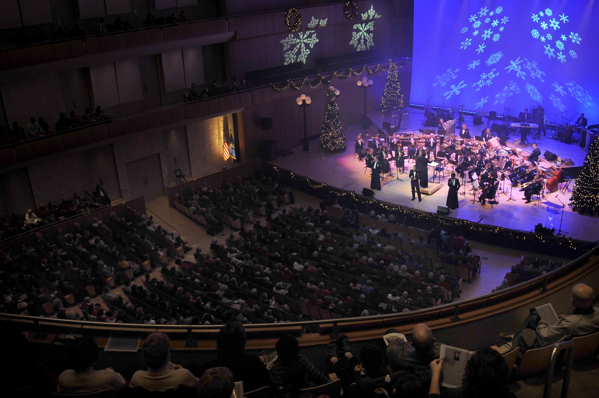 The U.S. Air Force Heartland of America Band from Offutt Air Force Base performs their first act for the annual holiday concert held at the Holland Performing Arts Center in Omaha, Neb., Dec. 7. The 2012 concert theme was “A Hometown Holiday” welcoming patrons from all over the Omaha area to a free concert. The Heartland of America Band works in conjunction with the Omaha World Herald to put the concert series together each year. (U.S. Air Force photo by Jeff W. Gates/Released)