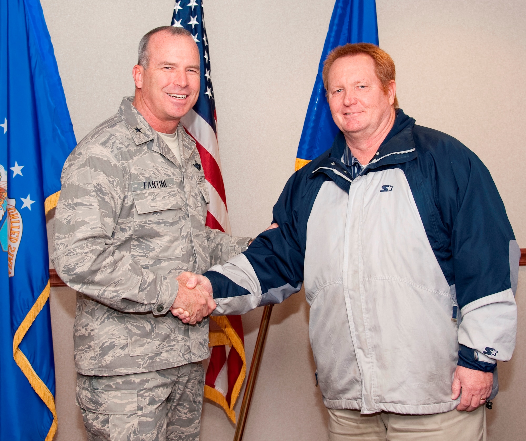 Brig. Gen. Michael Fantini (left), 82nd Training Wing commander, congratulates James Branch, 82nd Logistics Readiness Squadron, for being named the "Commander's Wingman of Choice" for Dec. 10-14 at Sheppard Air Force Base, Texas.  Branch was given a wing coin for earning the award during the 82nd TRW weekly staff meeting Dec. 12, 2012. (U.S. Air Force photo/Danny Webb)