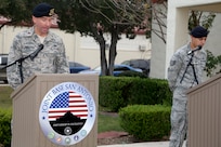 Airmen from the 902nd Security Forces Squadron attend the command dedication of their Operation Iraqi Freedom and Operation Enduring Freedom Defenders Wall Dec. 6. The memorial wall is in the 902nd SFS building at Joint Base San Antonio-Randolph honoring nine fallen Airman. (U.S. Air Force photo by Joshua Rodriguez)