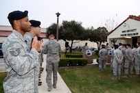Airmen from the 902nd Security Forces Squadron attend the command dedication of their Operation Iraqi Freedom and Operation Enduring Freedom Defenders Wall Dec. 6. The memorial wall is in the 902nd SFS building at Joint Base San Antonio-Randolph honoring nine fallen Airman. (U.S. Air Force photo by Joshua Rodriguez)