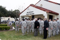 Airmen from the 902nd Security Forces Squadron attend the command dedication of their Operation Iraqi Freedom and Operation Enduring Freedom Defenders Wall Dec. 6. The memorial wall is in the 902nd SFS building at Joint Base San Antonio-Randolph honoring nine fallen Airman. (U.S. Air Force photo by Joshua Rodriguez)