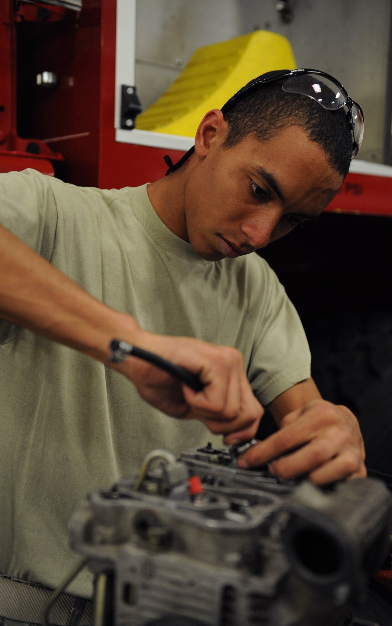 Senior Airman Marcus Smith, 2nd Logistics Readiness Squadron fire truck maintenance journeyman, repairs the engine of a generator on Barksdale Air Force Base, La., Dec. 10. Because of their importance to the mission, fire trucks require Airmen who specialize in maintaining them. (U.S. Air Force photo/Airman 1st Class Benjamin Gonsier)