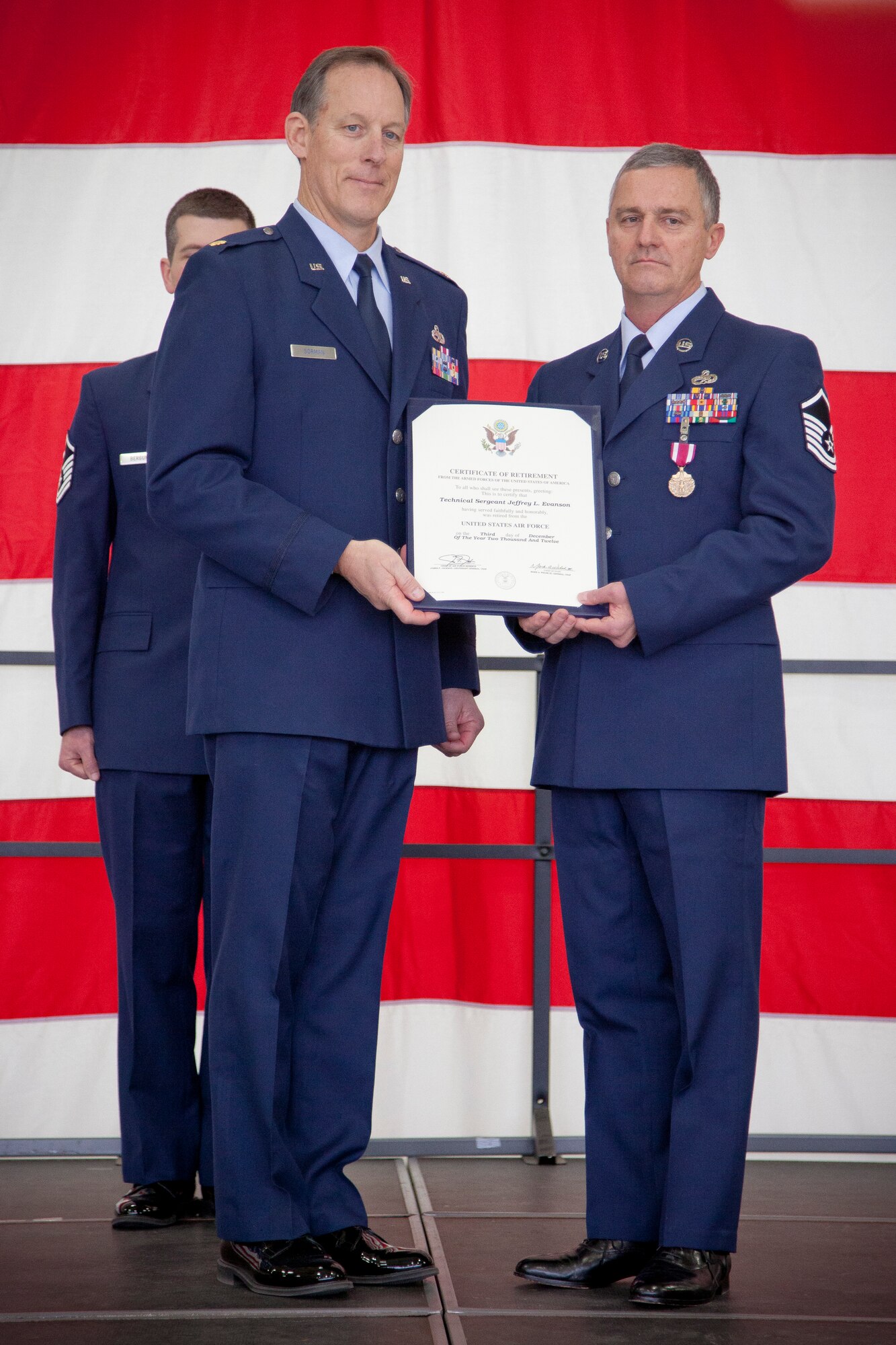 Major Jeff A. Gorman, 934th Maintenance Squadron commander, presents Master Sgt. Dave Strande with his certificate of retirement.  Strande retires from the 934 MXS, Minneapolis-St. Paul AIr Reserve Station, Minn., after 38 1/2 years of service. (U.S. Air Force Photo/Shannon McKay)