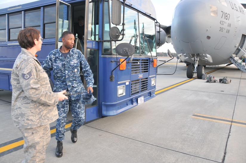 Petty Officer 3rd Class Ryan Davis, a ship’s serviceman from Joint Base Charleston – Weapons Station, Unaccompanied Personnel Housing Unit, steps out onto the flightline before an incentive flight Dec. 6, 2012, at Joint Base Charleston – Air Base. The incentive flight involved two C-17s, which were conducting air drop training missions at JB Charleston’s – North Auxiliary Air Field, (U.S. Air Force photo/ Airman 1st Class Jared Trimarchi)