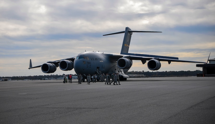 More than 50 quarterly award winners including Airmen, Sailors and civilians depart a C-17 Globemaster III during an incentive flight Dec. 6, 2012, at Joint Base Charleston – Air Base, S.C. The incentive flight involved two C-17s, which were conducting air drop training missions at JB Charleston – North Auxiliary Air Field, (U.S. Air Force photo/ Airman 1st Class Jared Trimarchi)