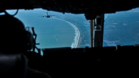 Two C-17 Globemaster IIIs, assigned to the 437th Airlift Wing at Joint Base Charleston, S.C., fly over the South Carolina Lowcountry coast during an incentive flight Dec. 6, 2012. More than 50 quarterly award winners attended an incentive flight involving two C-17s, which were conducting air drop training missions at JB Charleston’s – North Auxiliary Air Field. (U.S. Air Force photo/ Airman 1st Class Jared Trimarchi)