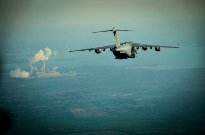 A C-17 Globemaster III, assigned to the 437th Airlift Wing at Joint Base Charleston, S.C., flies over the Lowcountry during an incentive flight, Dec. 6, 2012. More than 50 quarterly award winners attended an incentive flight involving two C-17s, which were conducting air drop training missions at JB Charleston’s – North Auxiliary Air Field. (U.S. Air Force photo/ Airman 1st Class Jared Trimarchi)