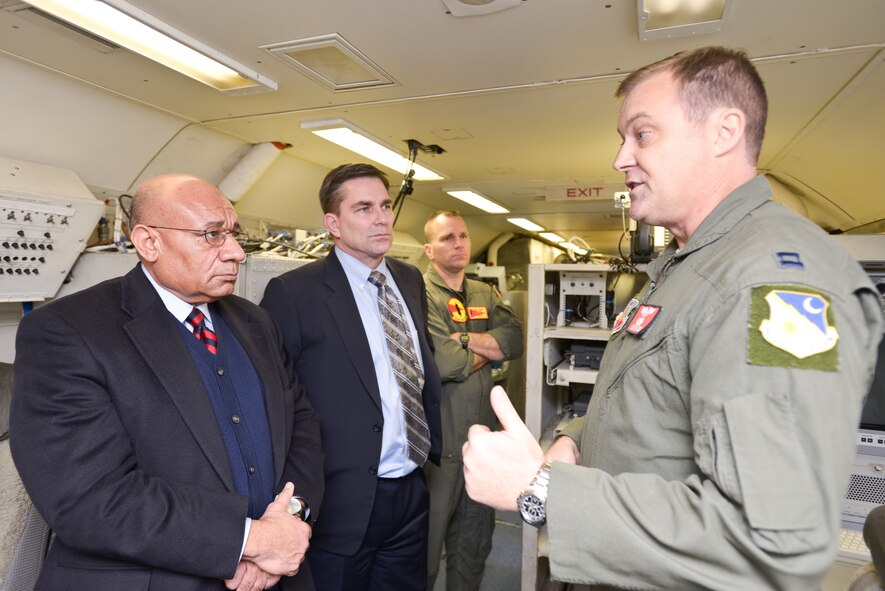 U.S. Air Force Capt. Joe, right, 461st Air Control Wing, speaks with members of the National Geospatial-Intelligence Agency (NGA) during a tour of the E-8C Joint STARS at Robins Air Force Base, Ga., Dec. 6, 2012.  The tour provided the opportunity for the NGA to learn more about the successes and capabilities of the Joint Surveillance Target Attack Radar System and discuss how Team JSTARS and the NGA can work together to meet global requirements.  (Portion of JSTARS aircrew member name not revealed for security purposes)(National Guard photo by Master Sgt. Roger Parsons/Released)