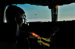 Capt. Brandon Dewey, 15th Airlift Squadron pilot, adjusts the heading of a C-17 Globemaster III during an incentive flight Dec. 6, 2012, over the Lowcountry of South Carolina. More than 50 quarterly award-winning Airmen and Sailors and civilians attended the incentive flight onboard two C-17s which were conducting an air drop training mission at Joint Base Charleston’s – North Auxiliary Air Field. (U.S. Air Force photo/ Airman 1st Class Jared Trimarchi)