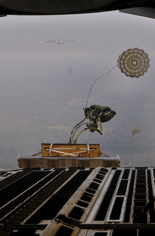 A pallet is air dropped from the back of a 437th Airlift Wing C-17 Globemaster III from Joint Base Charleston – Air Base, S.C., during an incentive flight Dec. 6, 2012, at JB Charleston’s - North Auxiliary Air Field. More than 50 quarterly award winners flew on the incentive flight aboard two C-17s which were conducting air drop training missions. (U.S. Air Force photo/ Airman 1st Class Jared Trimarchi)