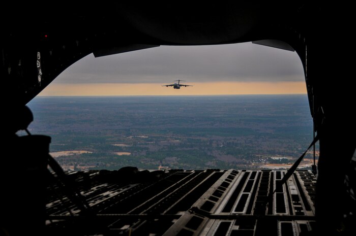 A C-17 Globemaster III, assigned to the 437th Airlift Wing at Joint Base Charleston – Air Base, soars above the Lowcountry during an incentive flight, Dec. 6, 2012.  More than 50 quarterly award winners attended the incentive flight onboard two C-17s, which were conducting air drop training missions at JB Charleston’s – North Auxiliary Air Field. (U.S. Air Force photo/ Airman 1st Class Jared Trimarchi)