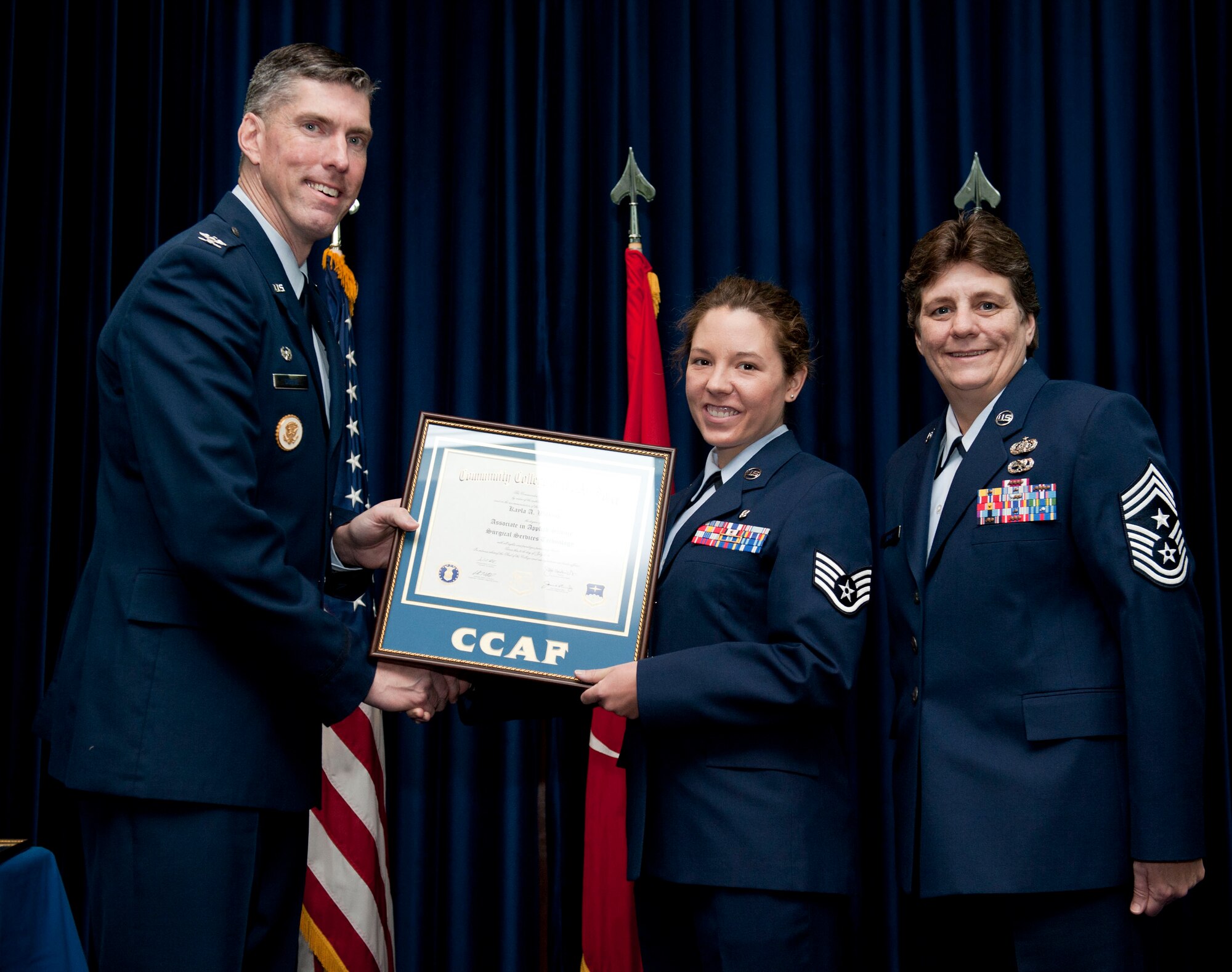 Staff Sgt. Kayla Wilkins, 39th Medical Operations Squadron, is awarded a degree from the Community College of the Air Force Dec. 7, 2012, at Incirlik Air Base, Turkey. The CCAF offers enlisted members the opportunity to earn associate degrees that relate to their Air Force Specialty Code. (U.S. Air Force photo by Senior Airman Clayton Lenhardt/Released)