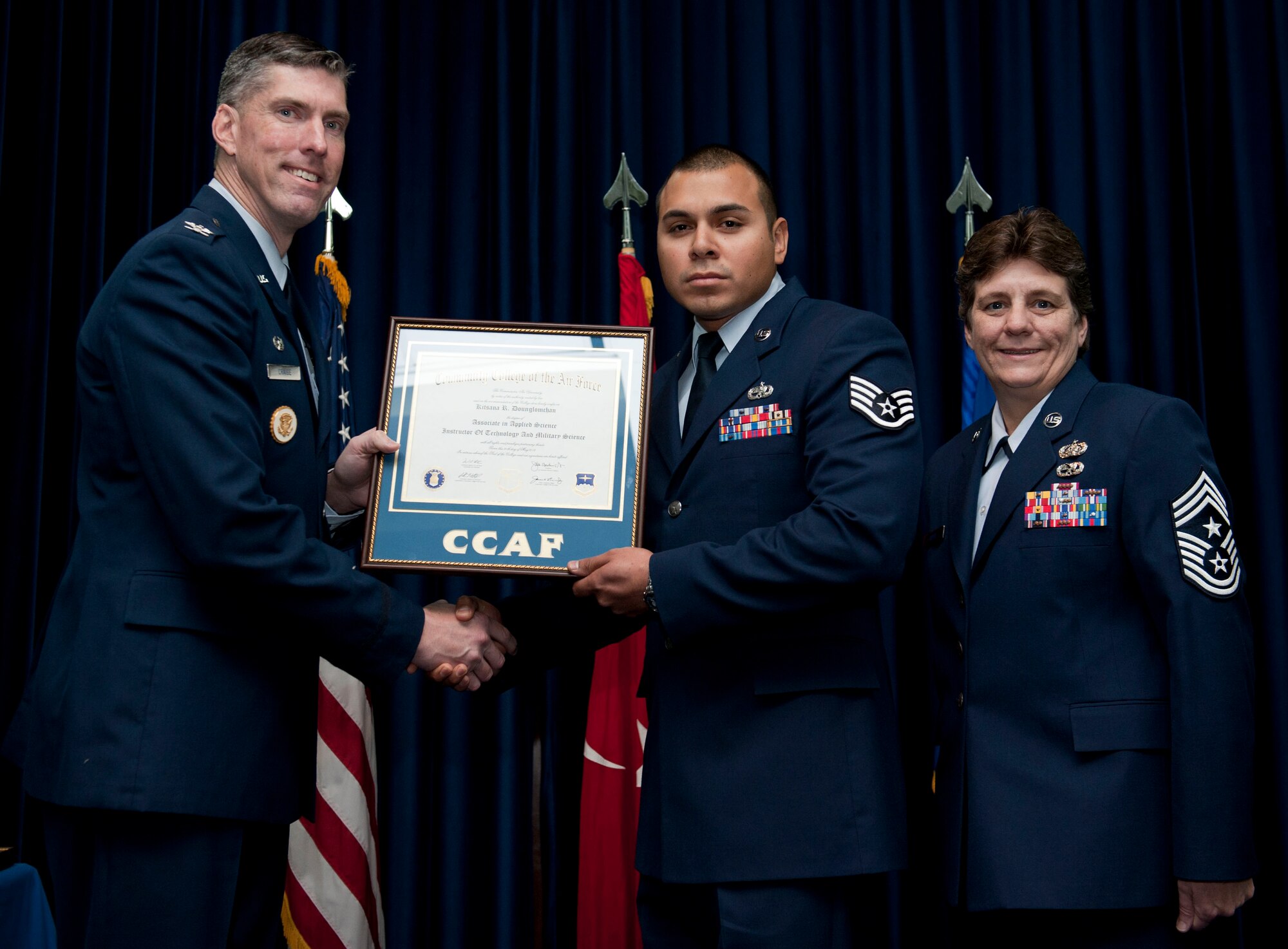 Staff Sgt. Joshua Van Dusen, 39th Maintenance Squadron, is awarded a degree from the Community College of the Air Force Dec. 7, 2012, at Incirlik Air Base, Turkey. The CCAF offers enlisted members the opportunity to earn associate degrees that relate to their Air Force Specialty Code. (U.S. Air Force photo by Senior Airman Clayton Lenhardt/Released)
