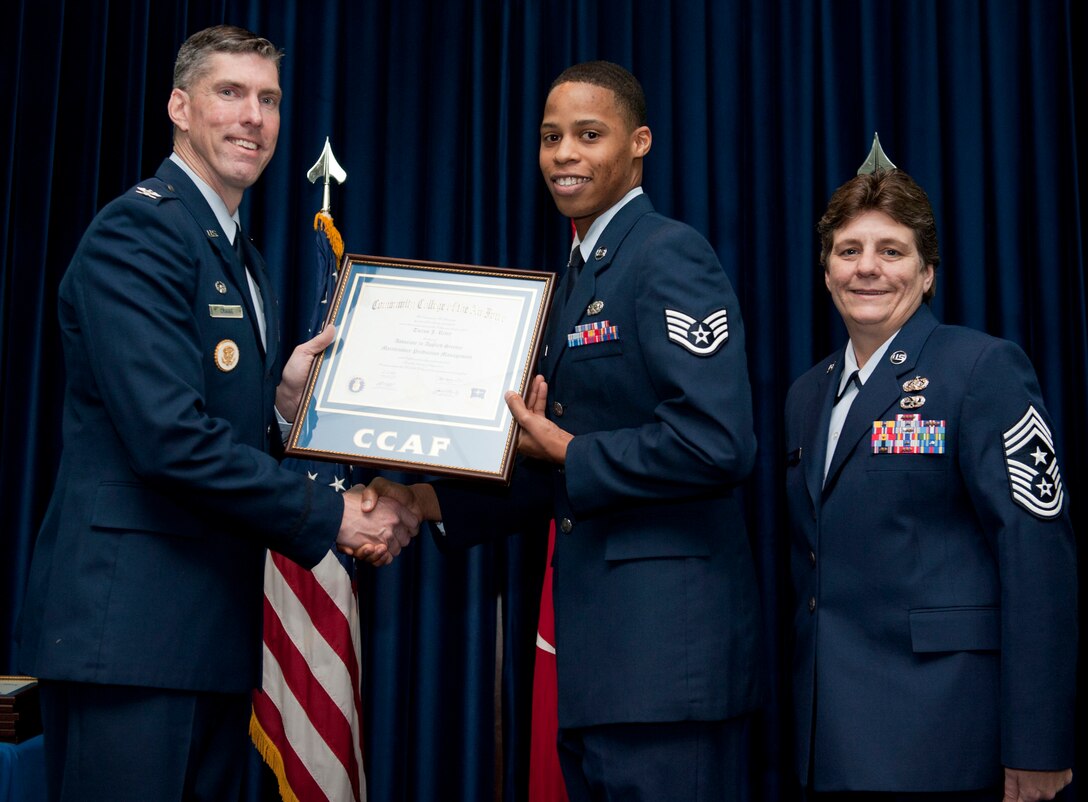 Staff Sgt. Tieron Riley, 39th Maintenance Squadron, is awarded a degree from the Community College of the Air Force Dec. 7, 2012, at Incirlik Air Base, Turkey. The CCAF offers enlisted members the opportunity to earn associate degrees that relate to their Air Force Specialty Code. (U.S. Air Force photo by Senior Airman Clayton Lenhardt/Released)