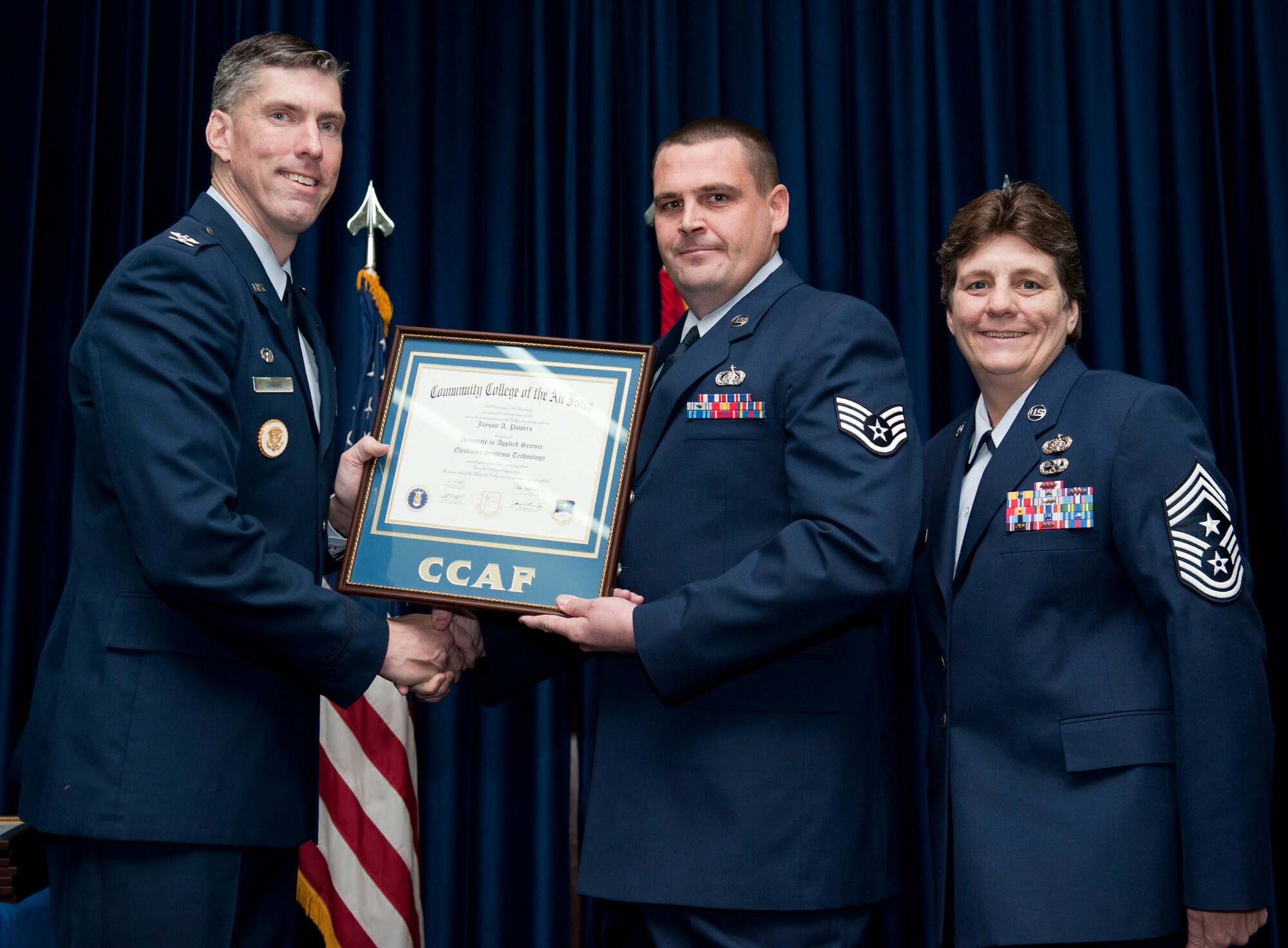 Staff Sgt. Jayson Powers, 39th Communications Squadron, is awarded a degree from the Community College of the Air Force Dec. 7, 2012, at Incirlik Air Base, Turkey. The CCAF offers enlisted members the opportunity to earn associate degrees that relate to their Air Force Specialty Code. (U.S. Air Force photo by Senior Airman Clayton Lenhardt/Released)