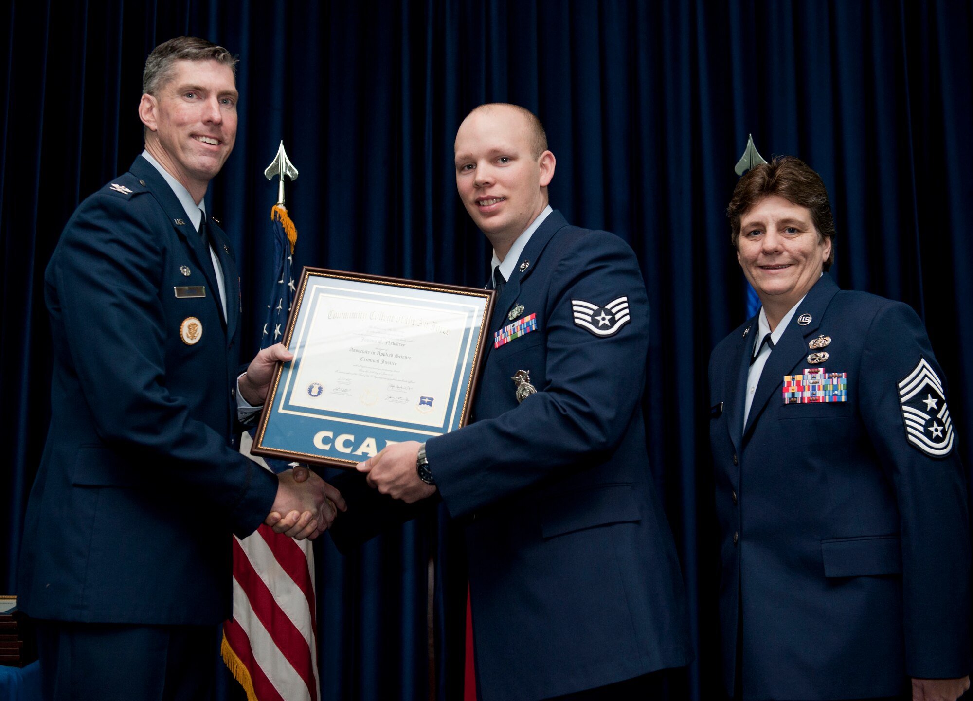 Staff Sgt. Joshua Newbrey, 39th Security Forces Squadron, is awarded a degree from the Community College of the Air Force Dec. 7, 2012, at Incirlik Air Base, Turkey. The CCAF offers enlisted members the opportunity to earn associate degrees that relate to their Air Force Specialty Code. (U.S. Air Force photo by Senior Airman Clayton Lenhardt/Released)