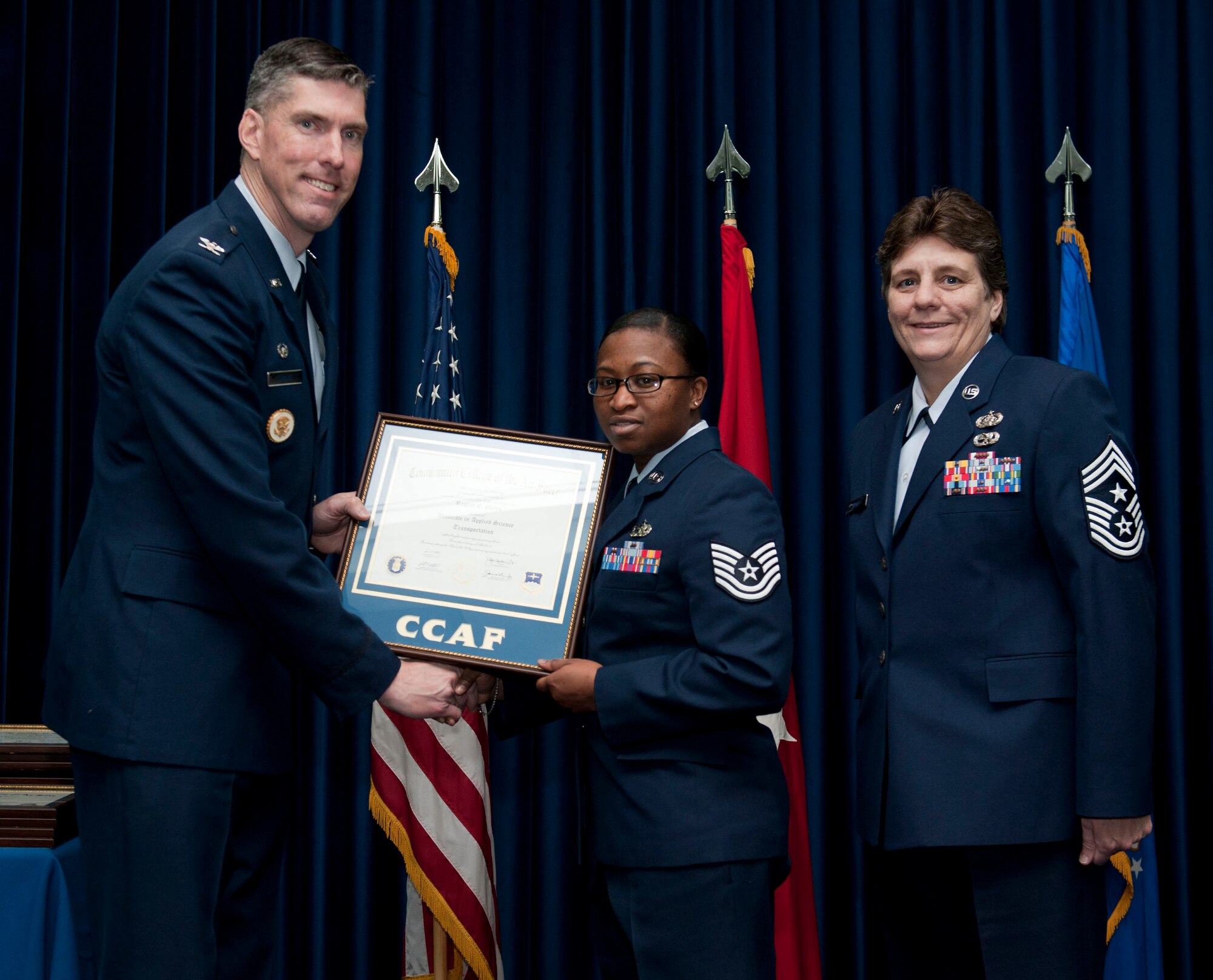 Tech. Sgt. Regina Green, 39th Logistics Readiness Squadron, is awarded a degree from the Community College of the Air Force Dec. 7, 2012, at Incirlik Air Base, Turkey. The CCAF offers enlisted members the opportunity to earn associate degrees that relate to their Air Force Specialty Code. (U.S. Air Force photo by Senior Airman Clayton Lenhardt/Released)