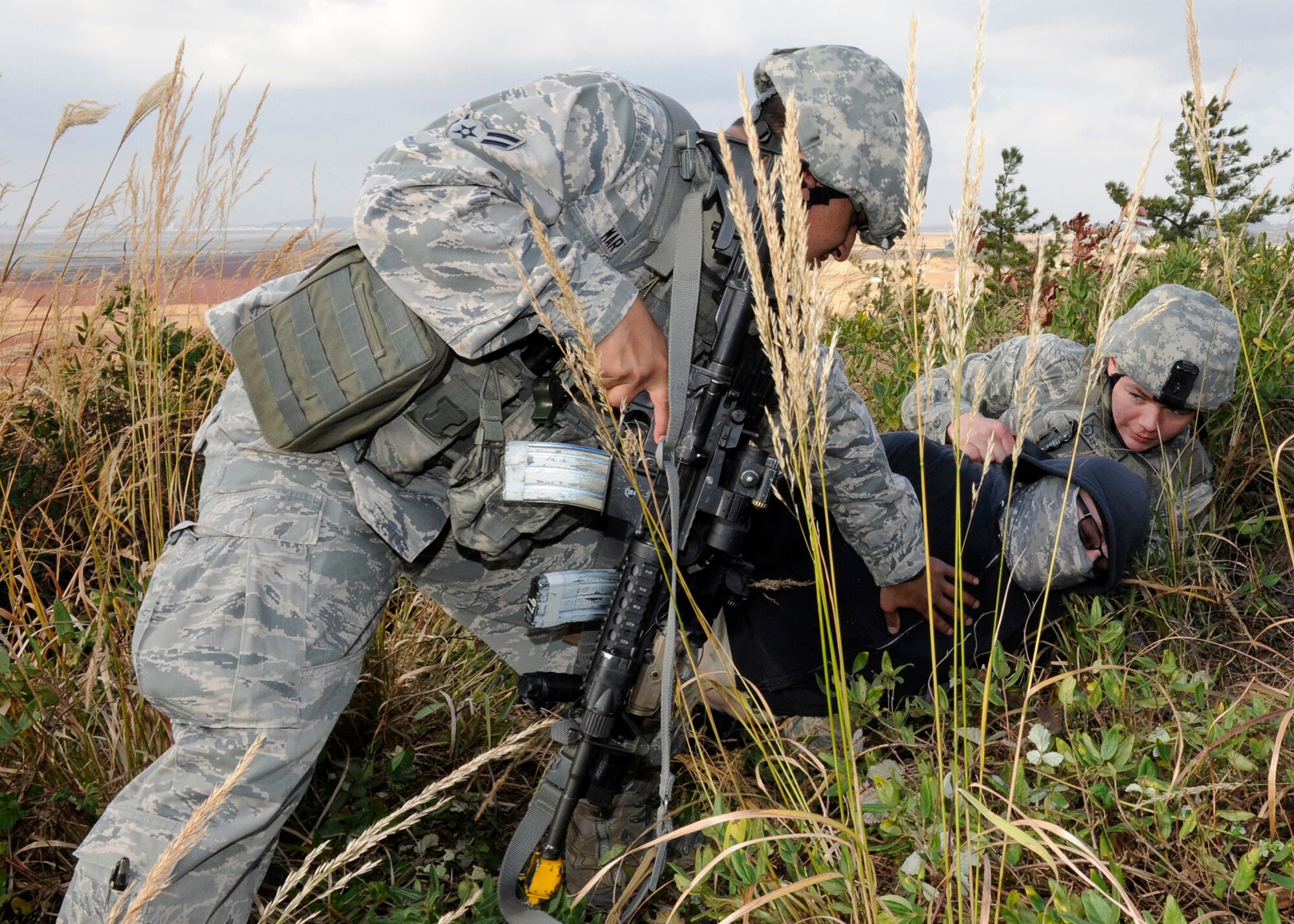 Airman 1st Class’ Jaime Martinez, left, and Lucas Givens, 8th Security Forces Squadron check a body for weapons during a training demonstration for the Neutral Nations Supervisory Commission on Kunsan Air Base, Republic of Korea, Nov. 18, 2012. The NNSC was established in 1953 after the ceasefire was declared in the Korean War and is an impartial body supervising the armistice agreement. (U.S. Air Force photo by Senior Airman Marcus Morris/released)