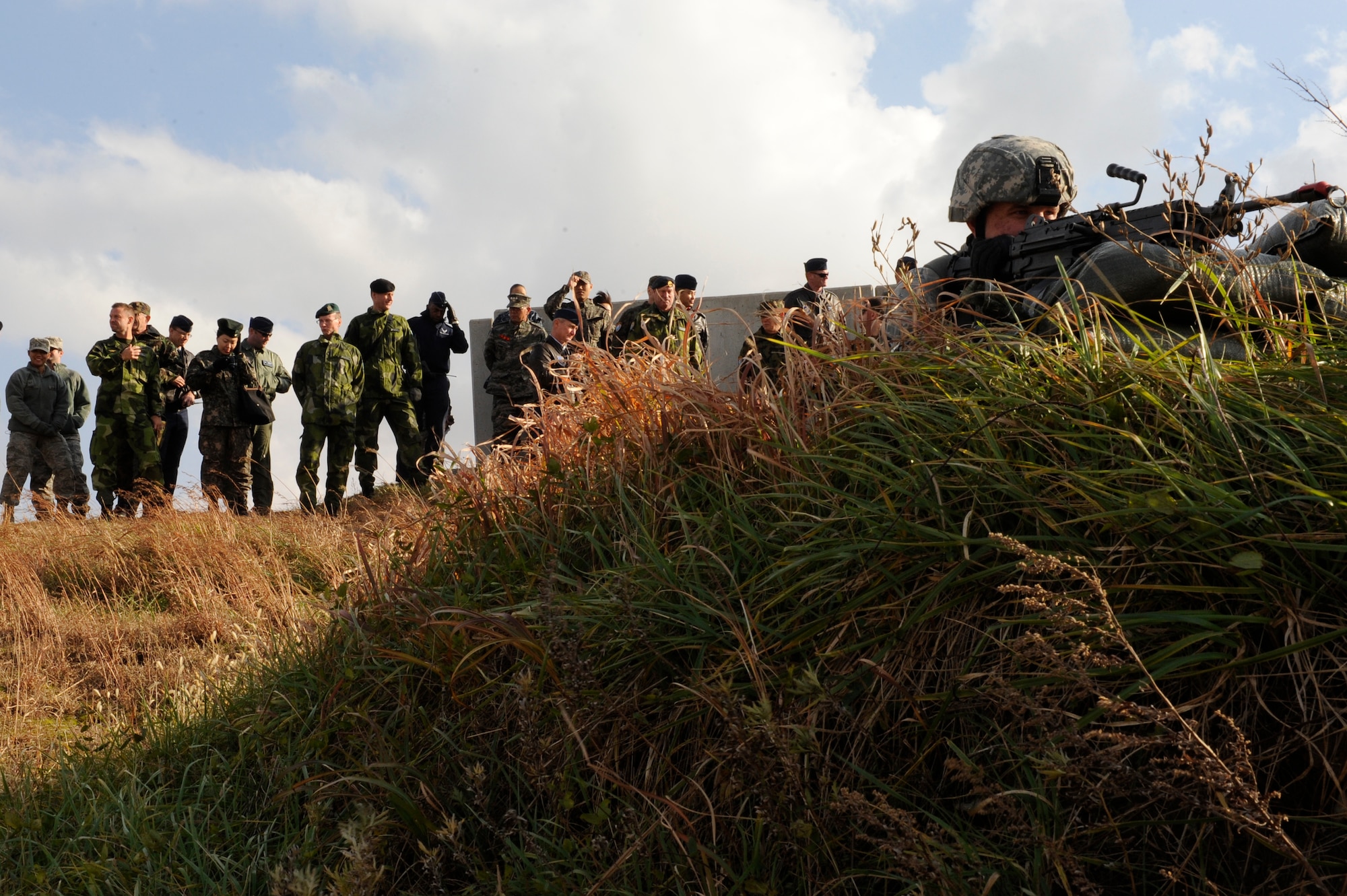 Airman 1st Class Sean James, 8th Security Forces Squadron demonstrates to the Neutral Nations Supervisory Commission how they handle threats on Kunsan Air Base, Republic of Korea, Nov. 18, 2012. The NNSC was established in 1953 after the ceasefire was declared in the Korean War and is an impartial body supervising the armistice agreement. (U.S. Air Force photo by Senior Airman Marcus Morris/released)
