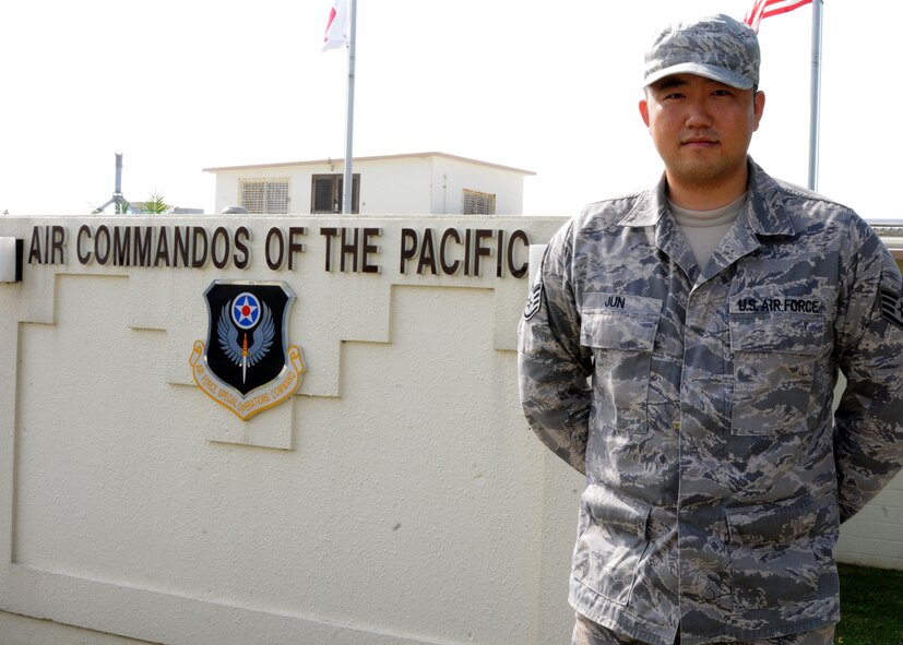 Staff Sgt. Jung Jun, a financial analyst with the 353rd Special Operations Group, poses for a photo in front of his squadron on Kadena Air Base, Japan, Dec. 4, 2012. Jung is one of the 73 enlisted members to recently be accepted for the Language Enabled Airman Program. (U.S. Air Force photo/Tech. Sgt. Kristine Dreyer)