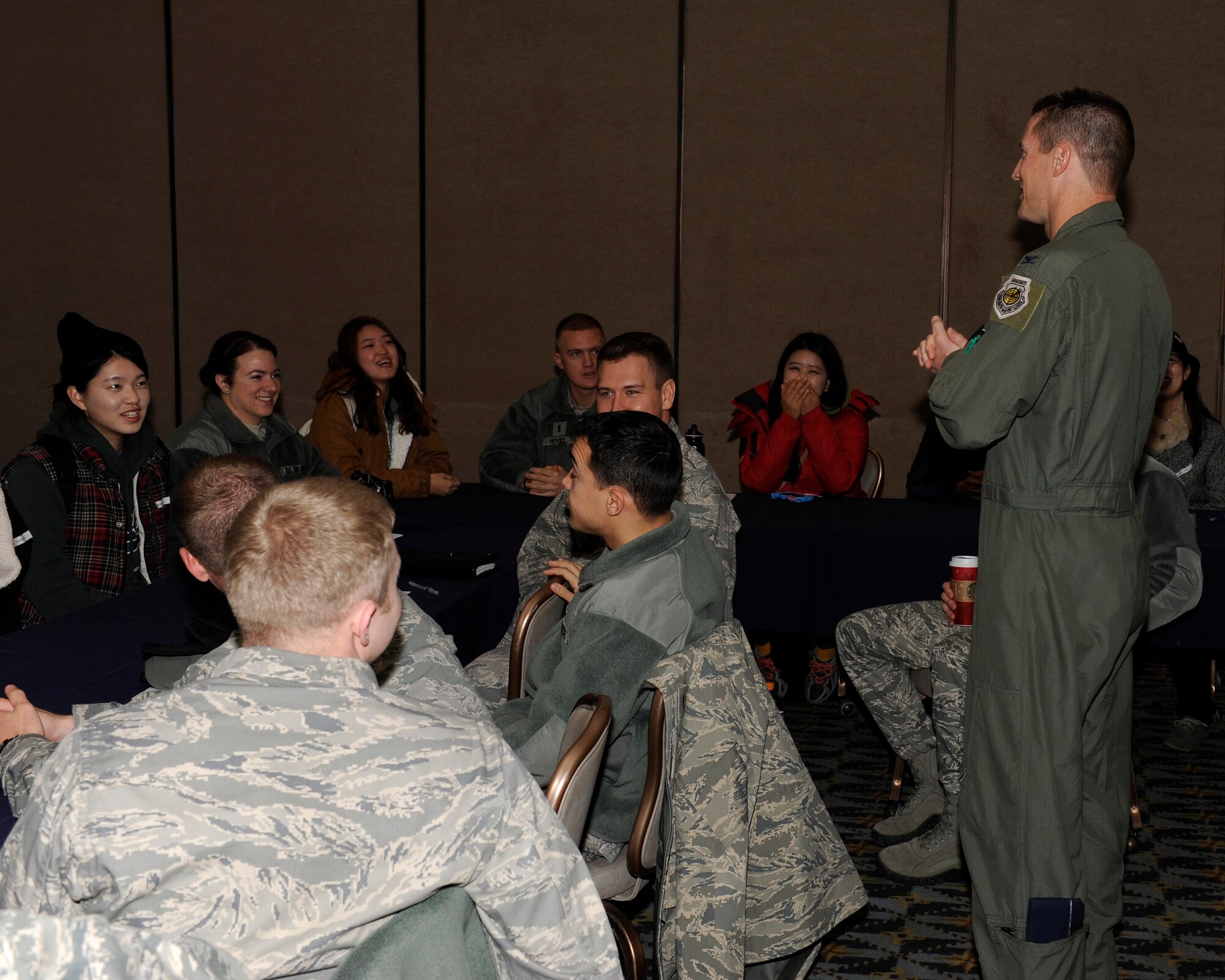 Col Douglas J. Nikolai, 8th Fighter Wing vice commander, greets Gunsan National University students during an exchange on Kunsan Air Base, Republic of Korea, Nov. 27, 2012. The exchange helped Gunsan’s younger generation to build a closer relationship with Kunsan Air Base. (U.S. Air Force photo by Senior Airman Marcus Morris/released)